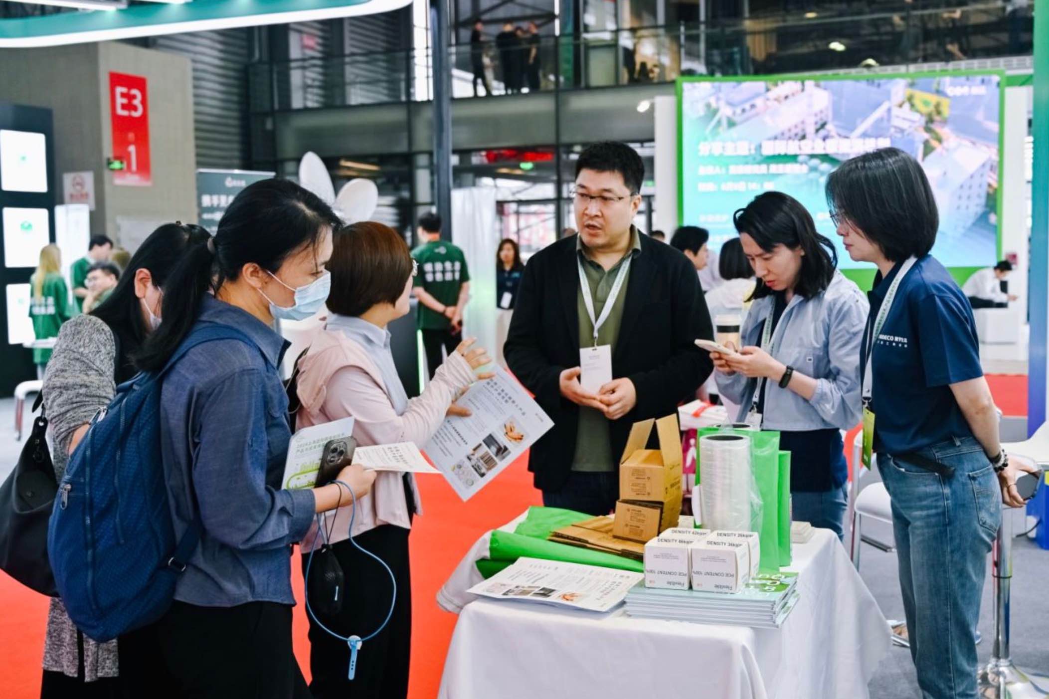Visitors interacting at the CM Venture Capital expo booth